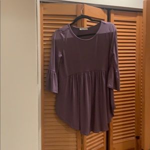 Flared purple top with bell bottom sleeves